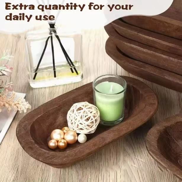 Rustic wooden bowl, perfect for home decor, filled with decorative balls and a candle.