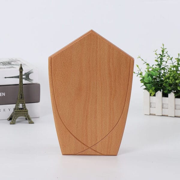 Custom Wood Plaque: Blank shield-shaped wooden plaque perfect for engraving and crafts.