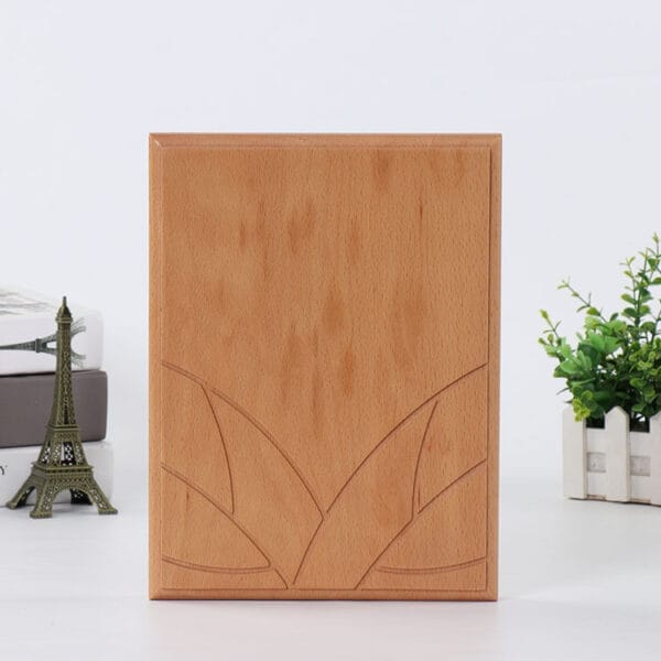 Custom Wood Plaque: Blank, engraved-ready wooden plaque perfect for crafts, awards, or DIY projects. Features a leaf design.