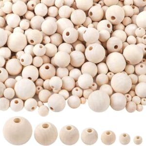 Assortment of natural wooden beads of varying sizes, perfect for crafting.