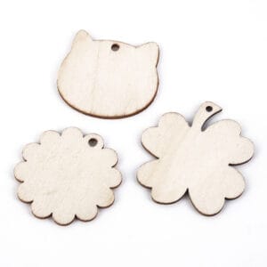Wooden craft shapes: Assorted unfinished wooden circles, clover, and cat shapes, perfect for DIY projects.