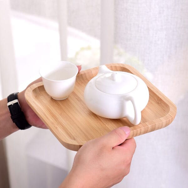 Bamboo serving tray with white ceramic teapot and teacup; perfect for tea ceremonies or gifting. Wholesale available.