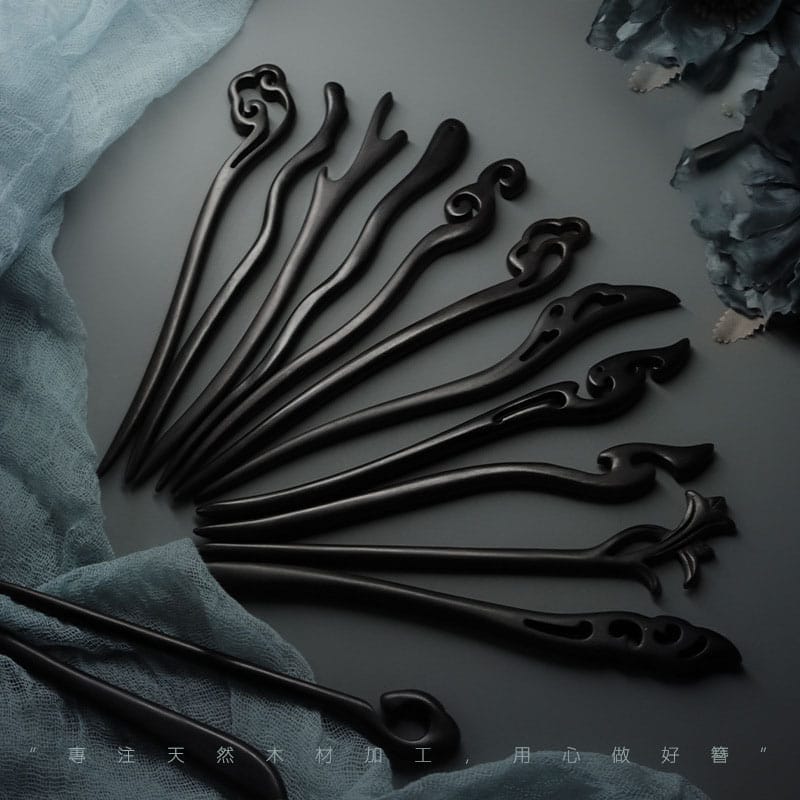 Handcrafted black wooden hair sticks; intricate carvings, wholesale available.