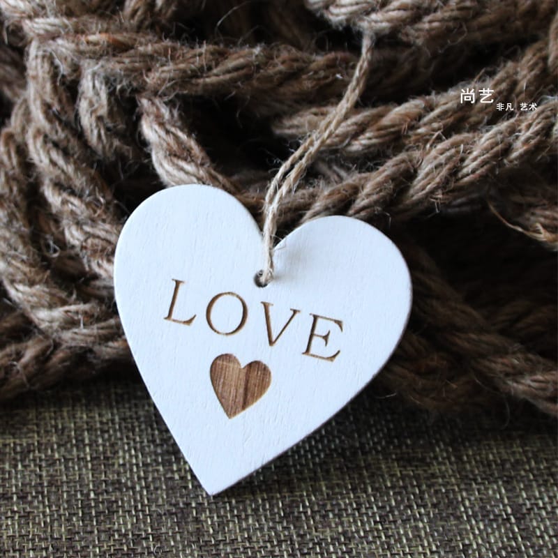 Custom Wooden Hearts: White wooden heart pendant with "LOVE" engraved, perfect for wedding crafts and decor. Wholesale available.