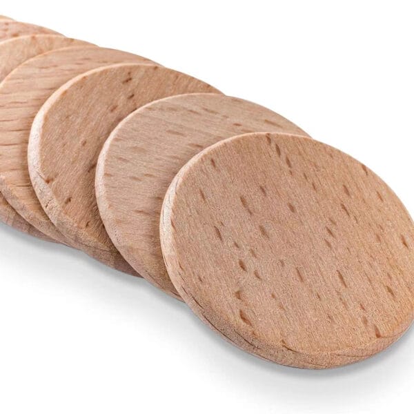 Custom Wooden Nickels: Stack of unfinished, round wooden discs, perfect for crafts, wholesale available.