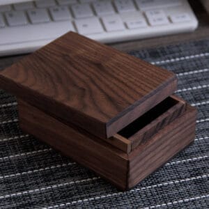 Wooden Trinket Box Wholesale: Dark brown laser engraved square wooden storage box with lid open, showcasing its interior.