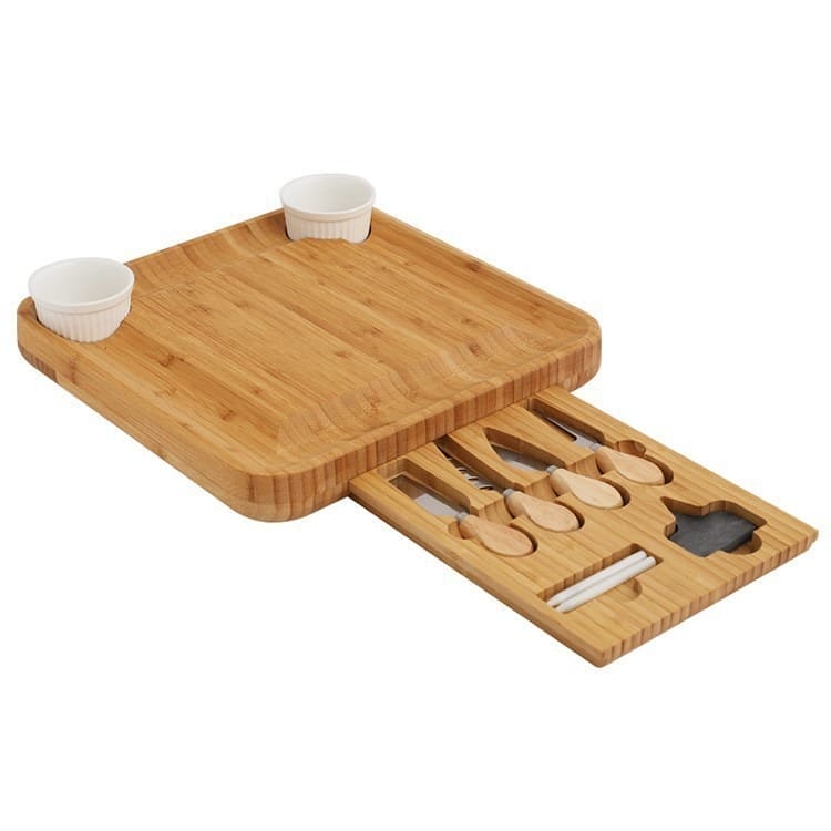 Bamboo cheese board with built-in drawer containing cheese knives and serving utensils. Perfect for cheese and appetizer serving.