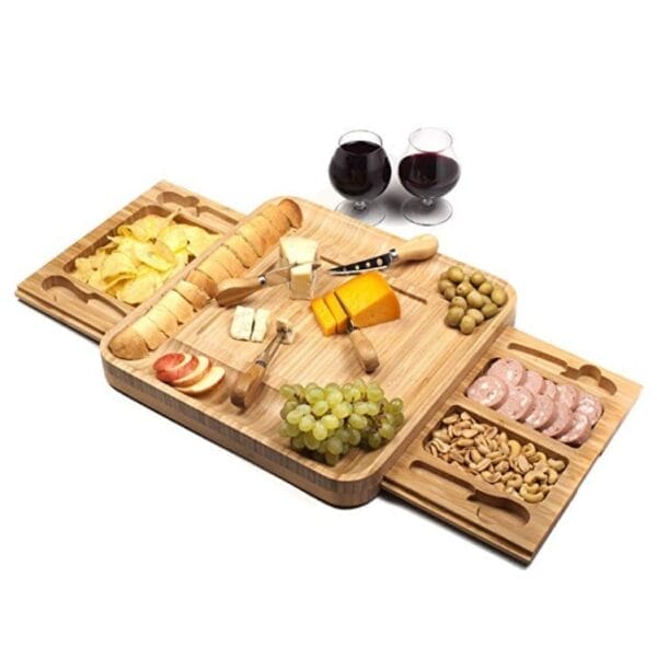 Bamboo charcuterie board with built-in drawers, perfect for serving cheese, crackers, and other appetizers. Includes cheese knives.
