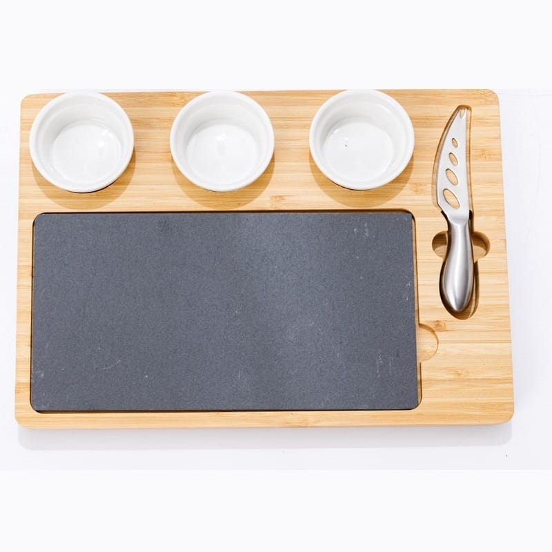 Bamboo cheese board with slate cutting surface, three small bowls, and built-in cheese knife. Perfect for cheese and appetizer serving.