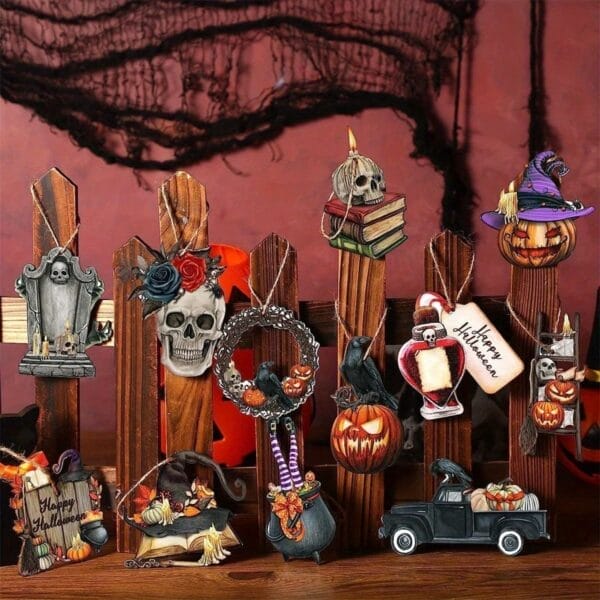 Halloween-themed wooden fence decorations with skulls, pumpkins, wreath, and vintage truck