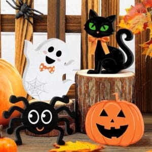Halloween decorations: friendly ghost, black cat, spider, and pumpkin.