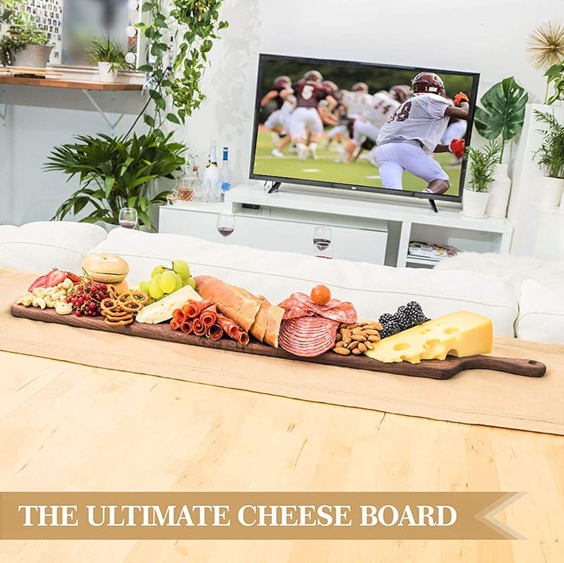 Wholesale Long Walnut Charcuterie Board: Large hanging cheese & serving plank, perfect for entertaining. Features a handle and ample space for cheese, meats, fruits, and bread.