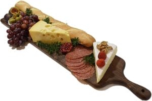 Wholesale Long Walnut Charcuterie Board: Large serving & cutting plank perfect for cheese, bread, fruit, & more. Features a convenient handle.