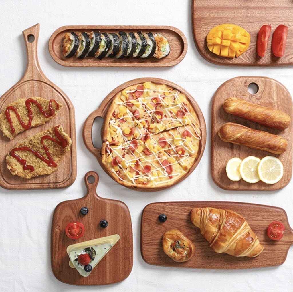 Set of acacia wood serving boards & platters, perfect for cheese, charcuterie, appetizers, pizza, sushi, and more. Stylish food presentation.