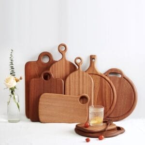 Set of handcrafted acacia wood cutting boards: various sizes & shapes, perfect for serving & chopping. Includes cheese & serving boards.