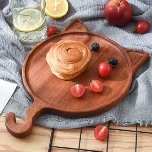 Wooden cat-shaped serving tray with a handle; perfect for snacks, appetizers, or home decor. Features a unique design and is made of high-quality wood.