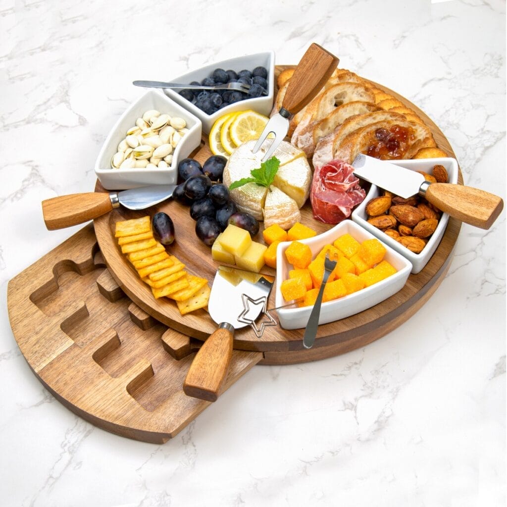 Wooden Cheese & Charcuterie Board: A round wooden serving tray with compartments for cheese, crackers, fruit, nuts, and more. Perfect for parties!