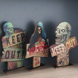 Wholesale Halloween wood signs: Set of three rustic spooky outdoor decorations featuring skulls, grim reaper, and "Keep Out" messages.
