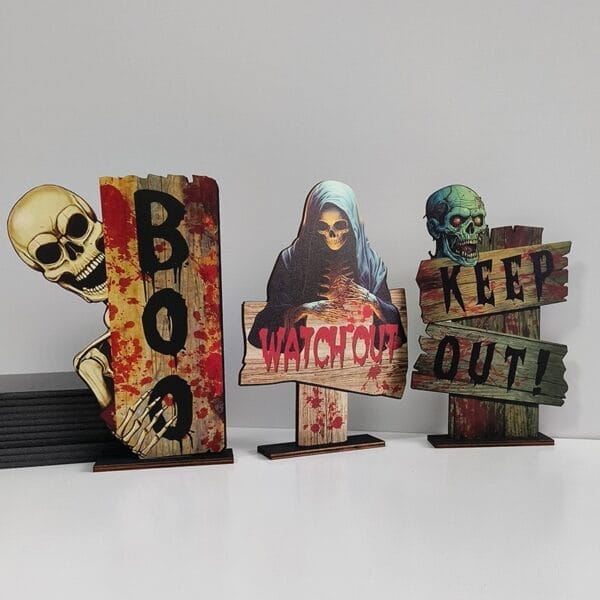 Wholesale Halloween Wood Signs: Set of three spooky rustic wood signs featuring a skeleton, grim reaper, and zombie, perfect for outdoor Halloween decorations.