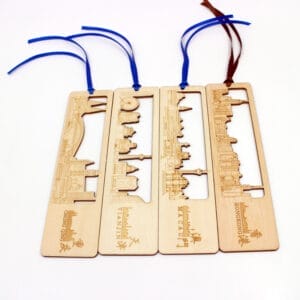 Four wooden laser-cut city skyline bookmarks: Chongqing, Tianjin, Macau, Hong Kong.