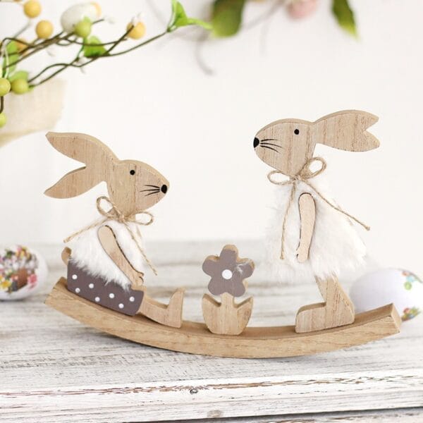 Easter Bunny Rocking Toy: Wooden Easter decor featuring two bunnies on a rocking base, with a flower, perfect Easter gift