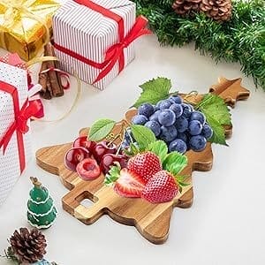 Wooden Christmas tree serving platter with grapes, strawberries, and cherries; perfect for holiday entertaining.