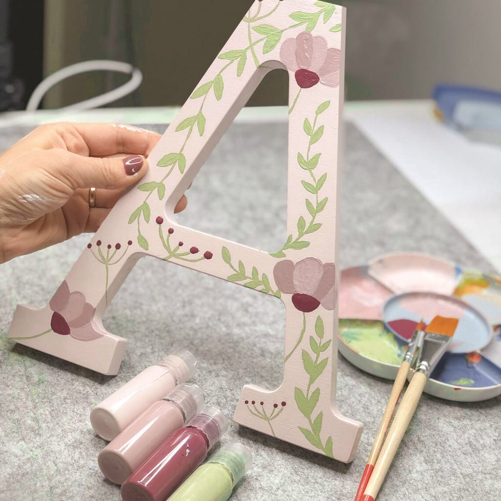 Hand-painted wooden letter "A" with floral design. Great for DIY projects and custom crafts. 8 Inch Wooden Letters Wholesale.