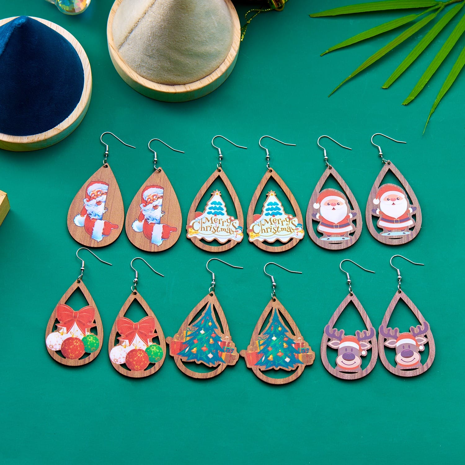 Christmas earrings: Wood teardrop earrings featuring Santa, Christmas trees, ornaments, and reindeer designs.