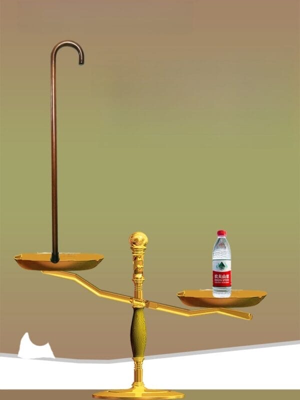 Scales balancing a Custom Wood Walking Cane against a bottle of water.