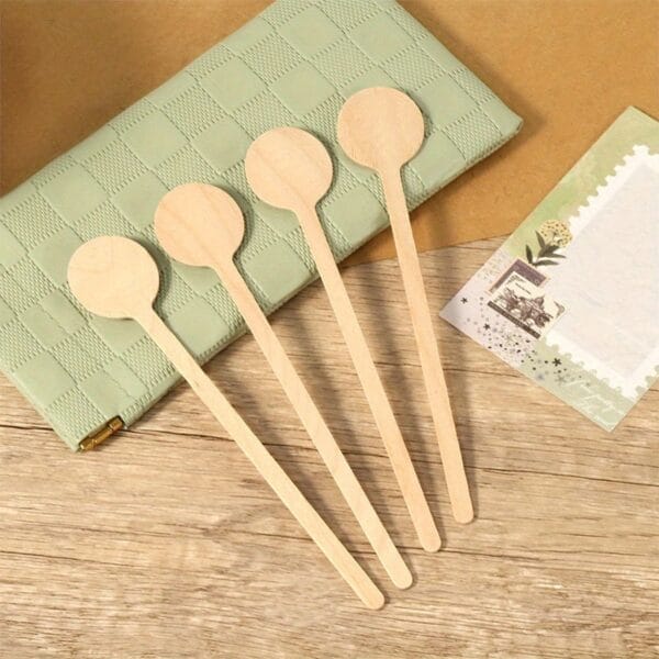Custom wooden stir sticks, perfect for coffee, tea, or craft projects. Natural wood stirrers.