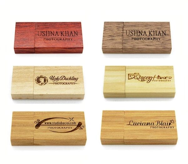 Six wooden USB drives with custom engraved logos for photographers; various wood finishes shown.