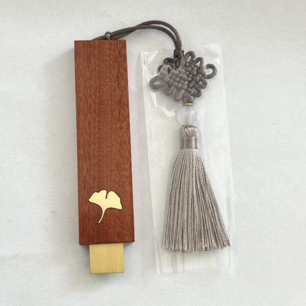 Personalized Wood USB Drive with ginkgo leaf and tassel. Custom wooden flash drive for logo engraving.