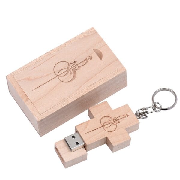 Wooden cross USB drive with keyring and engraved symbol, presented in matching wooden box.