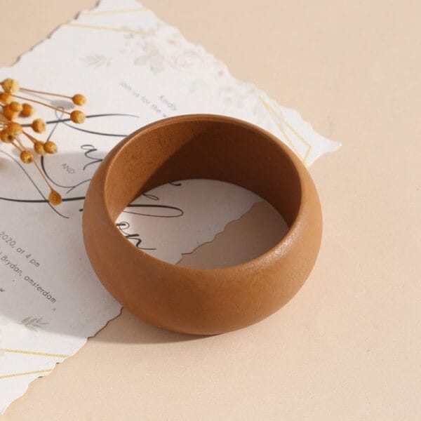 Geometric Wooden Bangle: Niche stackable brown wood bangle with a matte finish, 8.5-8.8 cm.