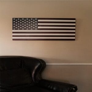 AUTO-DRAFT: Wooden American flag wall art hanging above a leather chair