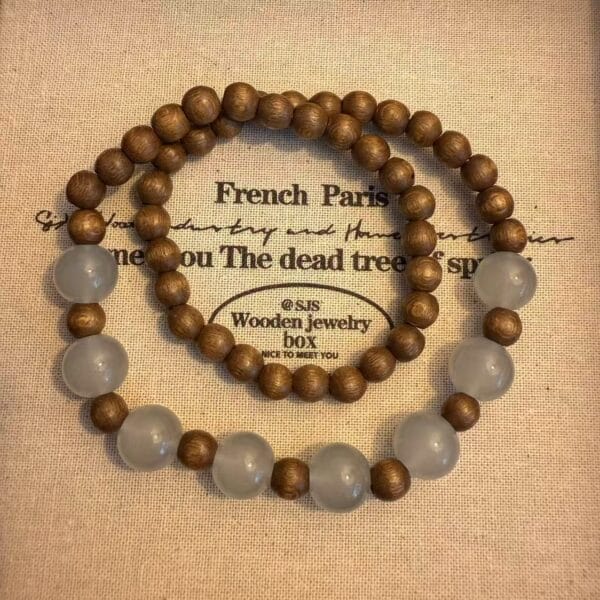 Wooden bead necklaces, one with grey accent beads. Stylish, handcrafted jewelry.