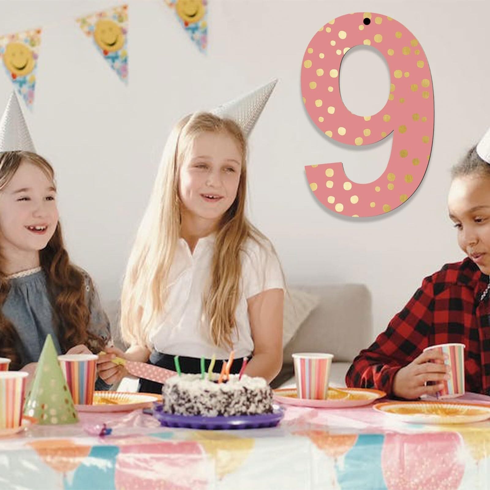 Girls at 9th birthday party, cake, decorations, pink number 9 decoration