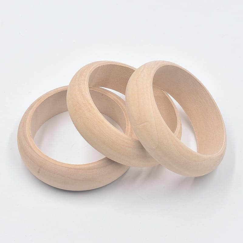Three unfinished wooden bangle bracelets stacked together