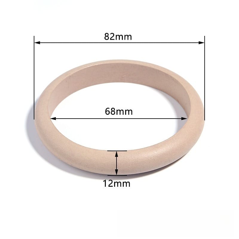 Polished natural wood bangle bracelet, light beige, with dimensions 82mm outer, 68mm inner, 12mm thick.