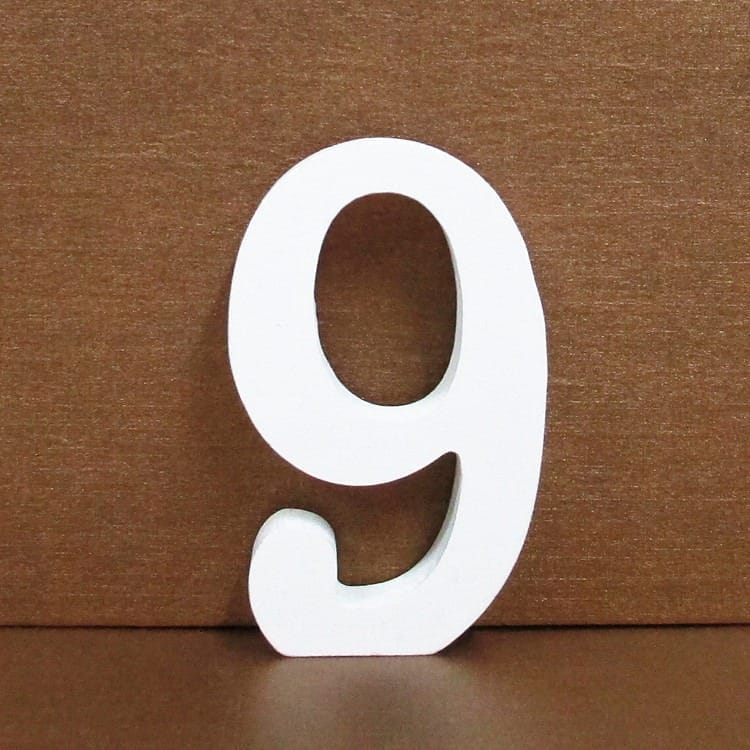 White number 9. Decorative wooden number nine for crafts or home decor.