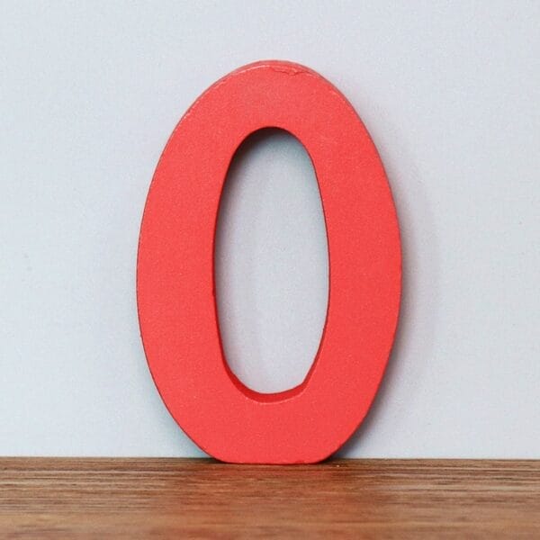 Red wooden number zero. Educational toy for learning numbers.