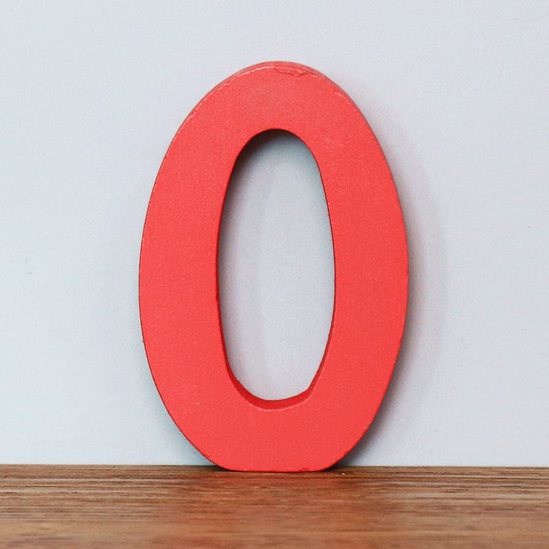 Red wooden number zero. Educational toy for learning numbers.
