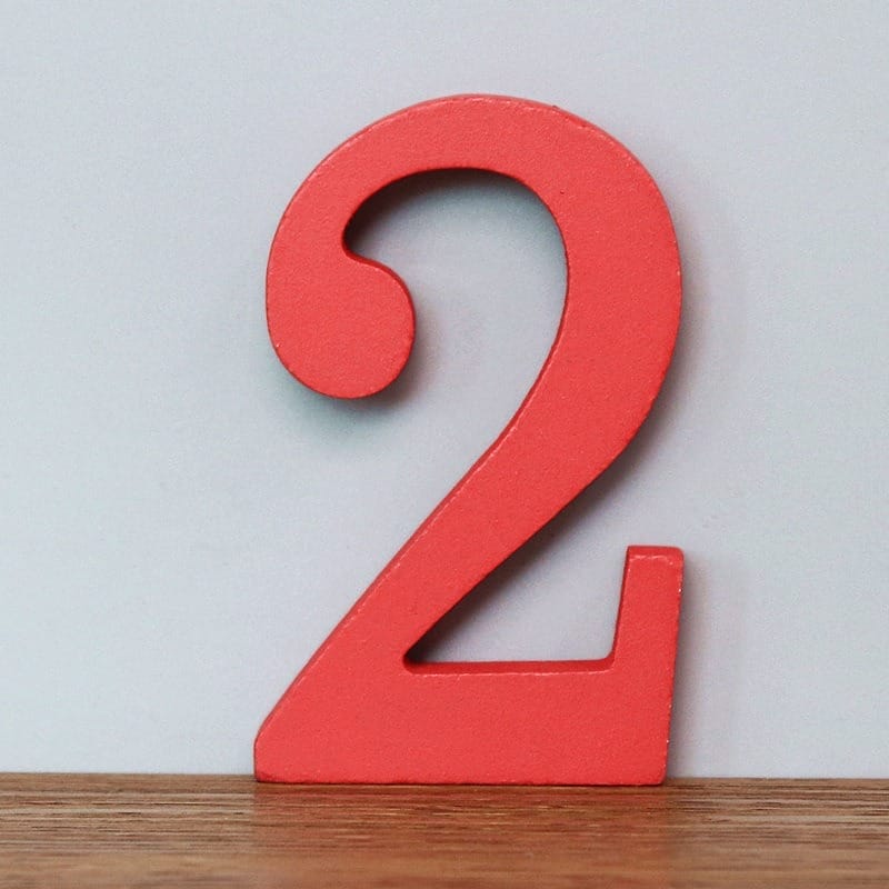 Red wooden number two figure for crafts or learning.