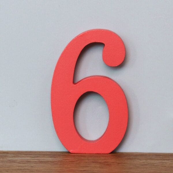 Red wooden number 6. AUTO-DRAFT.