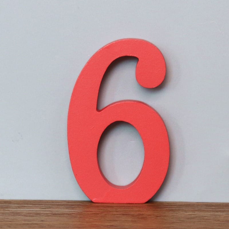 Red wooden number 6. AUTO-DRAFT.