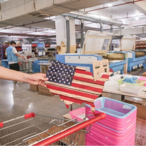 Custom Wooden US Flags Badge & Coin Display Rack: Rustic American flag keepsake organizer in a factory setting.
