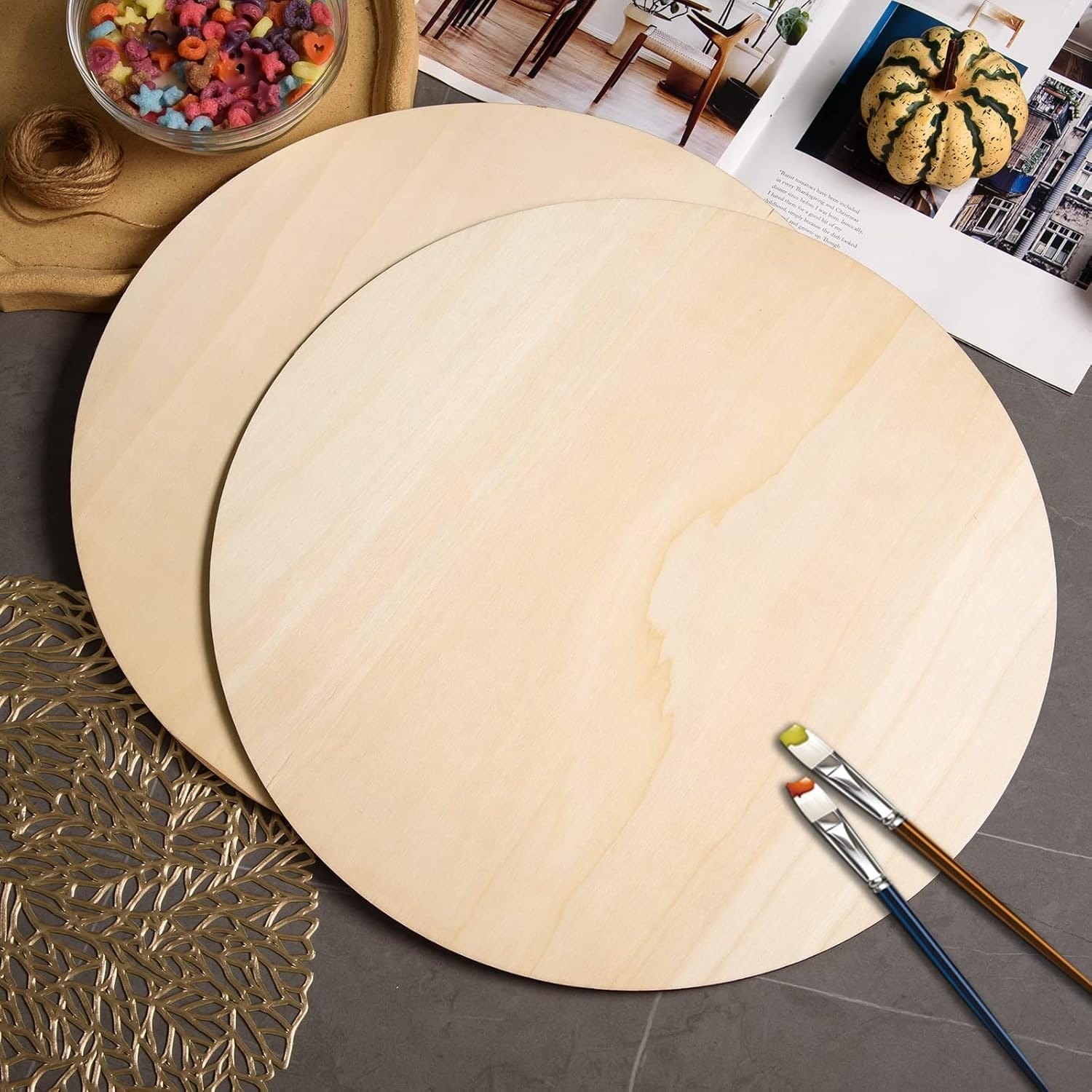 Wholesale Wood Rounds 18 Inch: Two unfinished round wood discs with craft supplies, ideal for DIY projects.