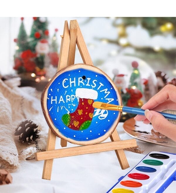 DIY Pine Wood Slice Ornament: Hand painting a Christmas stocking on a natural wood slice, crafting holiday decor.