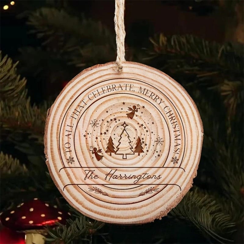 Rustic wood slice ornament with "Merry Christmas" message, Christmas trees, angels, and personalized family name.