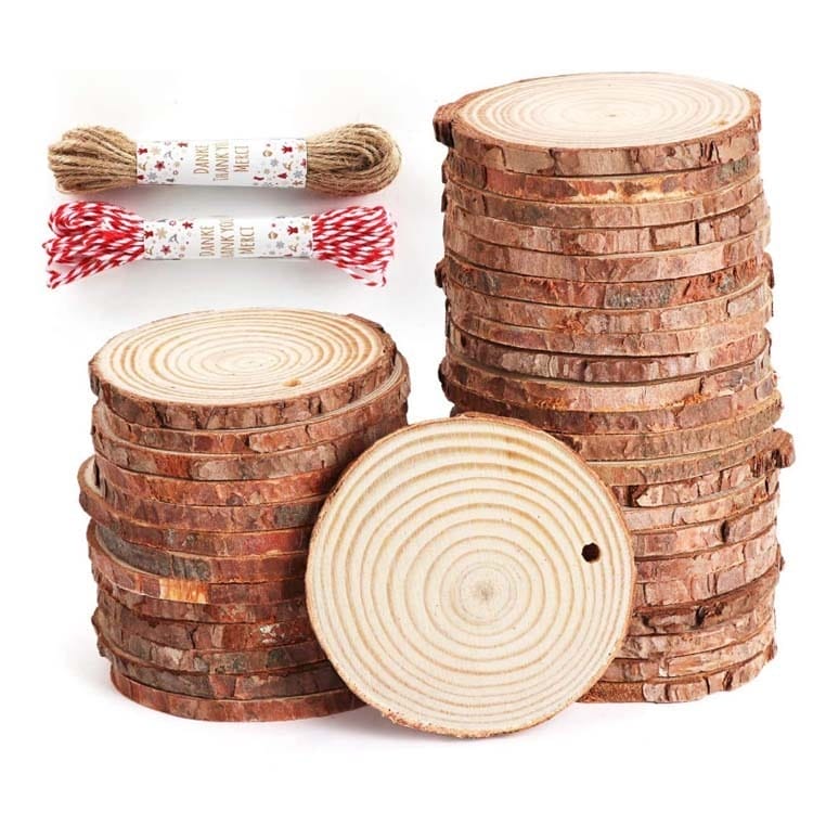 Wood slices stacks with bark edges and twine for crafts.